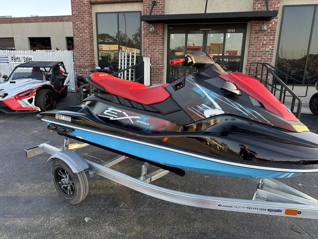 Slide: The Image of 2024 Yamaha Marine Waverunner EX SPORT in black and cyan with red seat. - 4