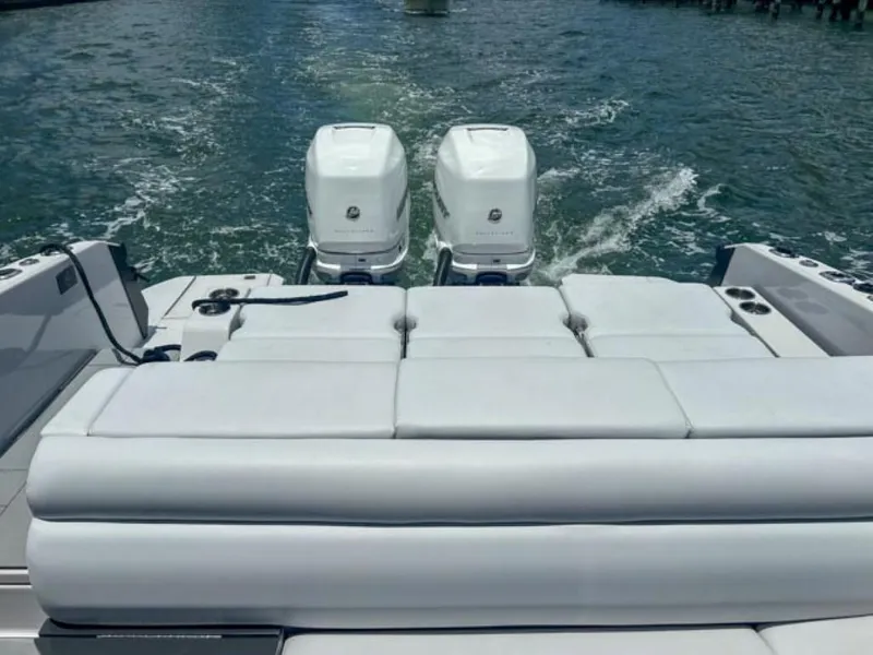 Slide: The Image of 2020 Aviara AV32 OB boat with twin outboard engines on water. - 20