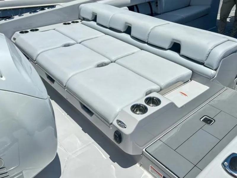 Slide: The Image of 2020 Aviara AV32 OB boat with spacious white cushioned seating and cup holders. - 21