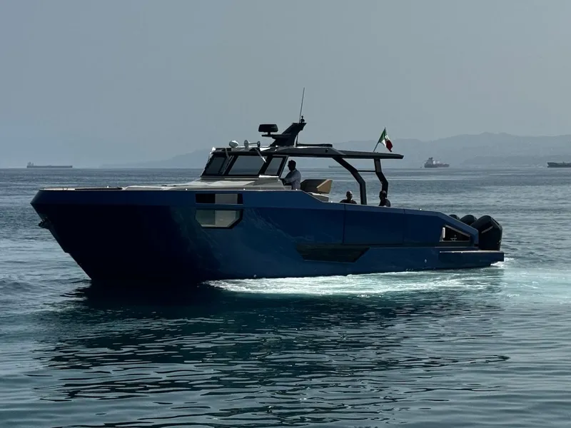 Slide: The Image of 2025 Aicon Audace 50 yacht cruising on calm waters, side view. - 2