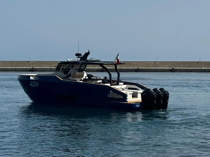 Slide: The Image of 2025 Aicon Audace 50 yacht on calm water near a pier. - 24