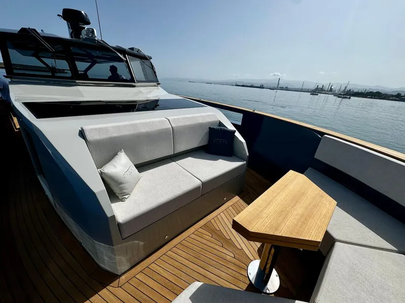 Slide: The Image of Luxurious 2025 Aicon Audace 50 yacht deck with modern seating and wooden table. - 37