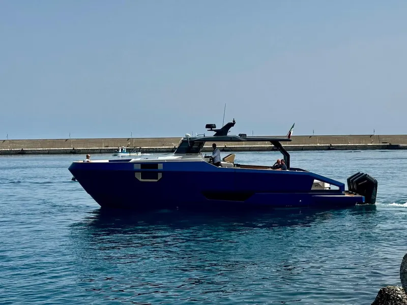 Slide: The Image of 2025 Aicon Audace 50 yacht cruising in calm waters near a pier. - 19