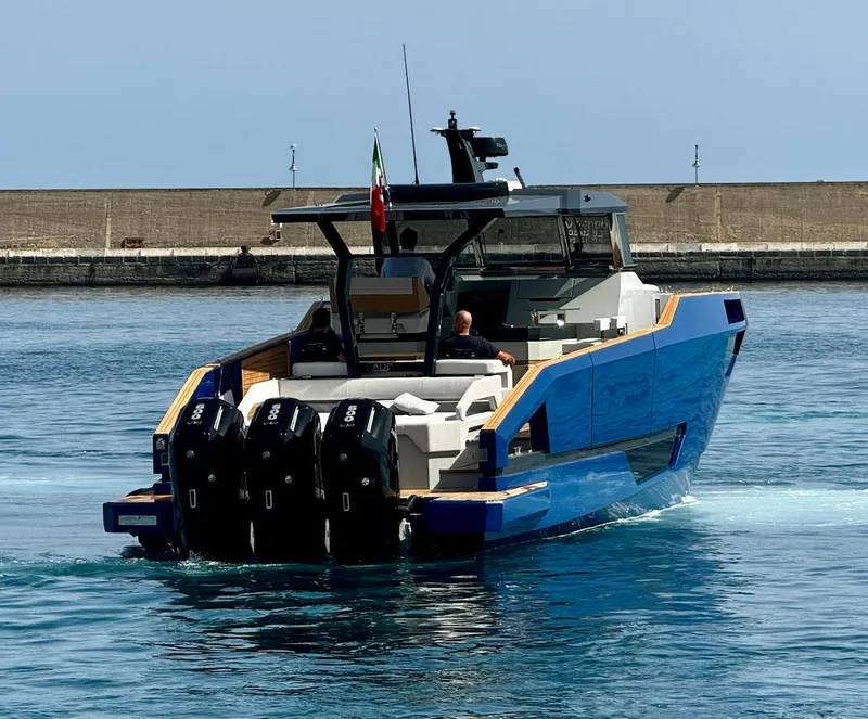 Slide: The Image of Aicon Audace 50 yacht, 2025 model, cruising in a harbor with powerful engines. - 27