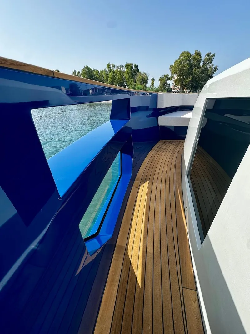 Slide: The Image of Aicon Audace 50 yacht deck, 2025 model, featuring sleek design and wooden flooring. - 31