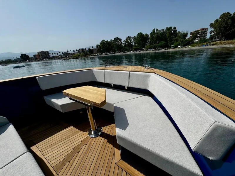 Slide: The Image of Luxurious Aicon Audace 50 yacht interior, 2025 model, with elegant seating and wooden table. - 33