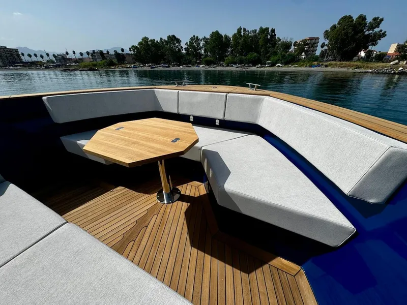 Slide: The Image of Luxurious 2025 Aicon Audace 50 yacht with elegant seating and wooden deck. - 34