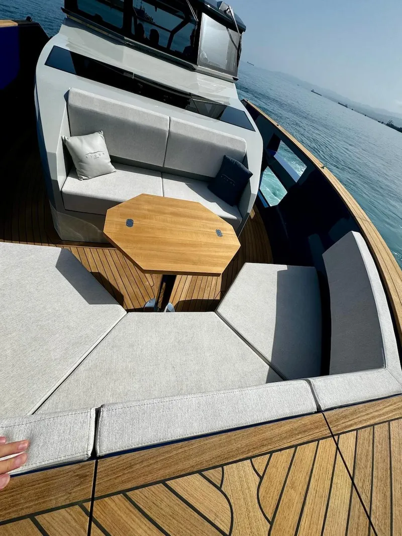 Slide: The Image of Luxurious 2025 Aicon Audace 50 yacht with elegant seating and wooden deck. - 35