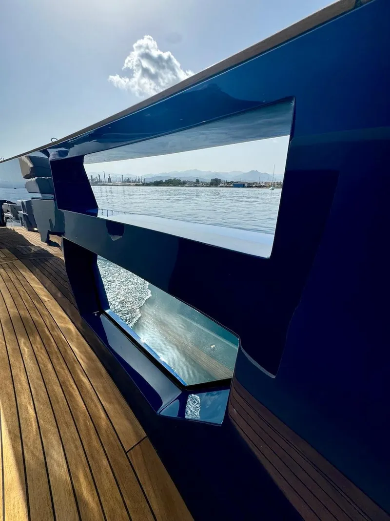 Slide: The Image of Aicon Audace 50 yacht, 2025 model, sleek design with wooden deck and ocean view. - 44
