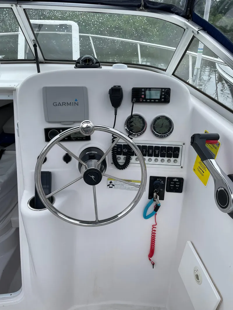 Slide: The Image of 2015 Pro-Line 20 Express Cuddy boat helm with Garmin navigation system. - 16