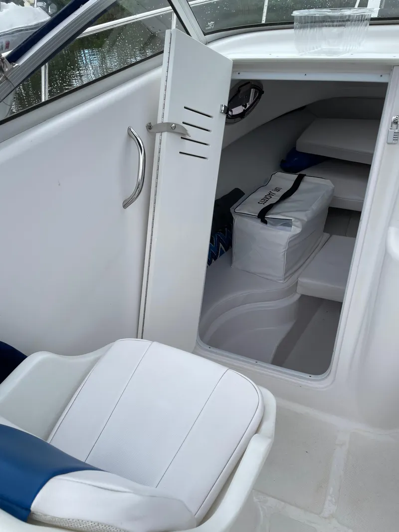 Slide: The Image of 2015 Pro-Line 20 Express Cuddy cabin interior with seating and storage. - 17