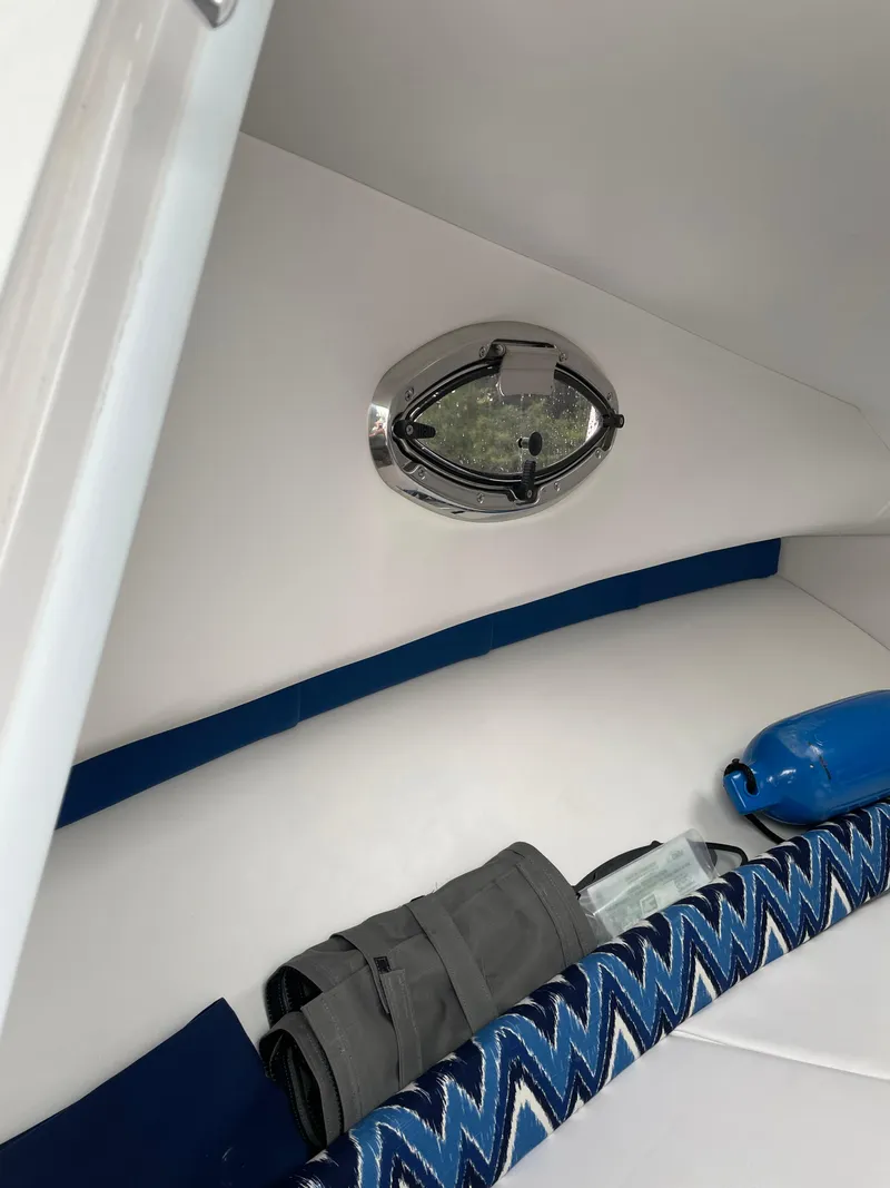 Slide: The Image of Interior of 2015 Pro-Line 20 Express Cuddy with window and storage. - 19