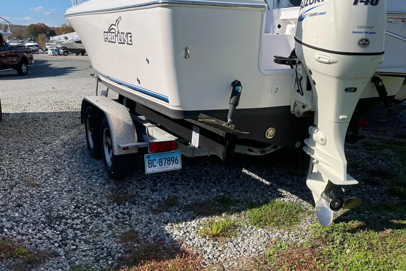 Slide: The Image of 2015 Pro-Line 20 Express Cuddy boat on a trailer with Suzuki outboard motor. - 4