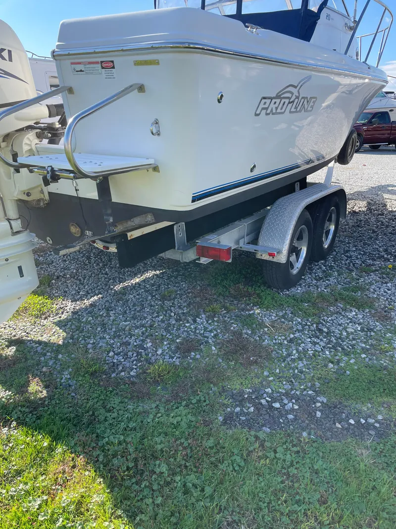 Slide: The Image of 2015 Pro-Line 20 Express Cuddy boat on a dual-axle trailer. - 6