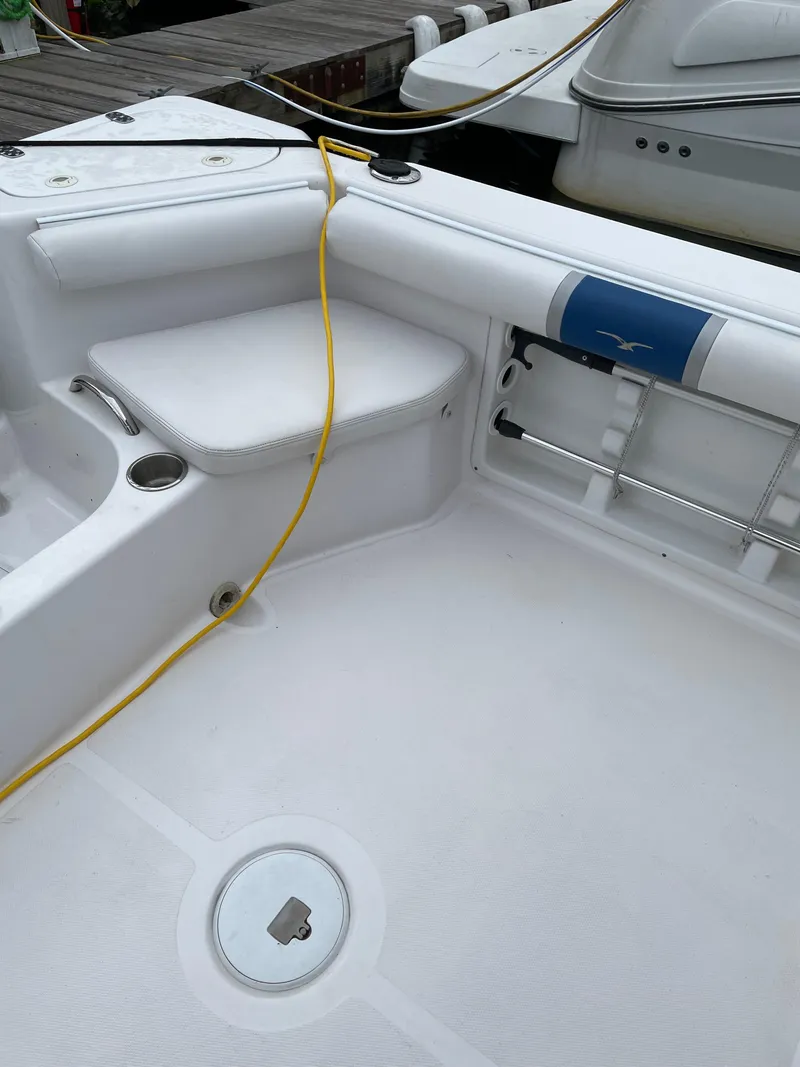 Slide: The Image of 2015 Pro-Line 20 Express Cuddy boat interior with seating and storage. - 7
