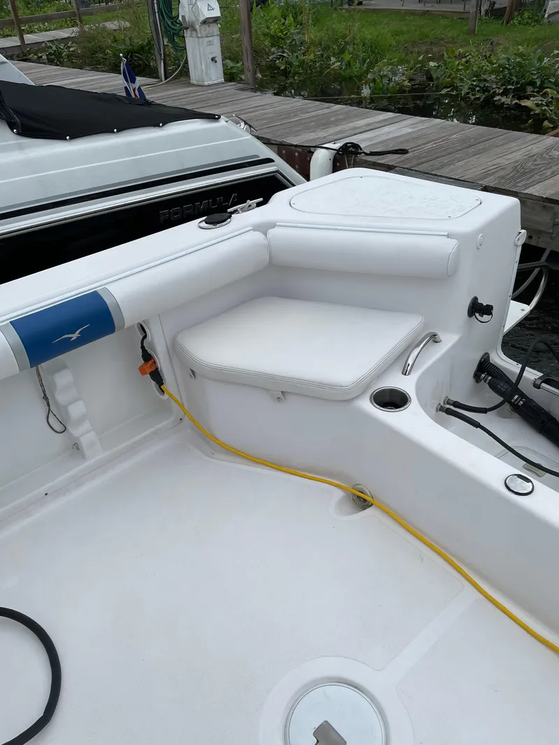 Slide: The Image of 2015 Pro-Line 20 Express Cuddy boat interior with seating and storage. - 8