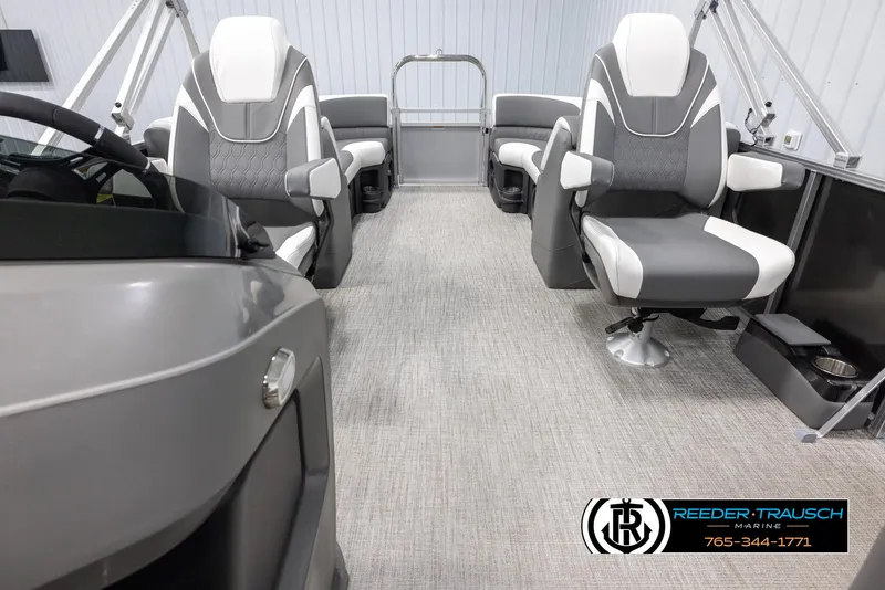 Slide: The Image of 2024 Avalon LSZ QL boat interior with modern seating and steering console. - 14