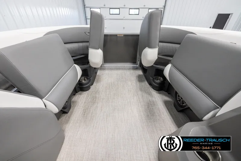 Slide: The Image of 2024 Avalon LSZ QL boat interior with gray seating and cup holders. - 20