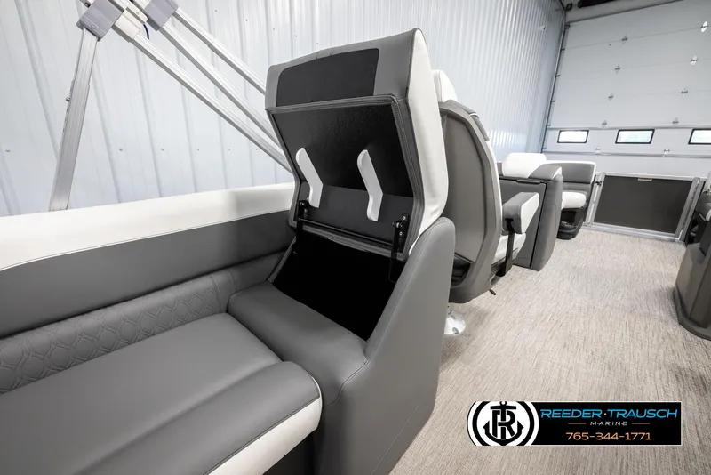 Slide: The Image of 2024 Avalon LSZ QL boat interior with gray and white seating and storage compartment. - 22