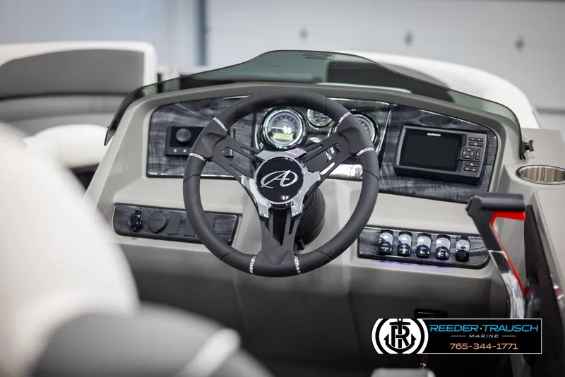 Slide: The Image of 2024 Avalon LSZ QL boat dashboard with steering wheel and control panel. - 23