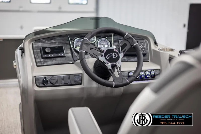 Slide: The Image of 2024 Avalon LSZ QL boat dashboard with steering wheel and control panel. - 24