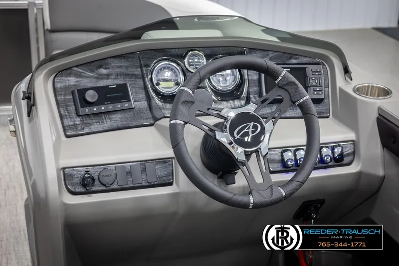 Slide: The Image of 2024 Avalon LSZ QL boat dashboard with steering wheel and control panel. - 25