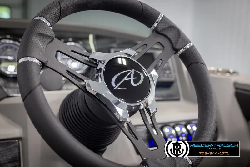 Slide: The Image of Close-up of 2024 Avalon LSZ QL steering wheel with dashboard in the background. - 26