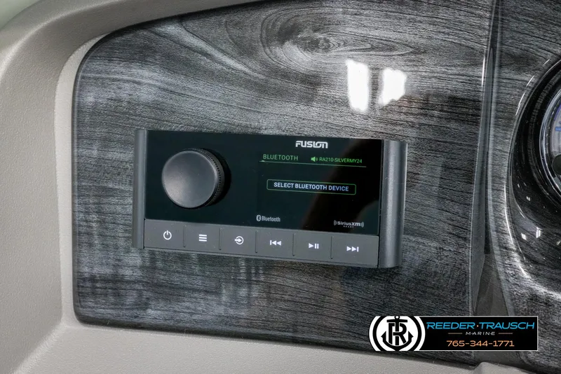 Slide: The Image of 2024 Avalon LSZ QL boat dashboard with Fusion Bluetooth audio system. - 27