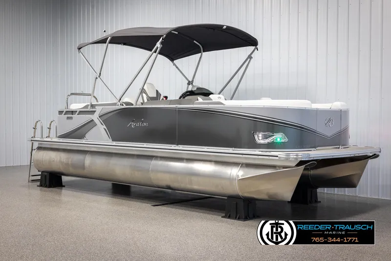 Slide: The Image of 2024 Avalon LSZ QL pontoon boat with canopy in showroom. - 3