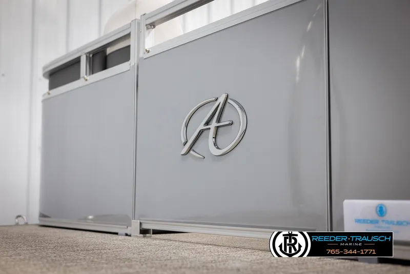 Slide: The Image of 2024 Avalon LSZ QL pontoon boat with sleek gray exterior and logo. - 40