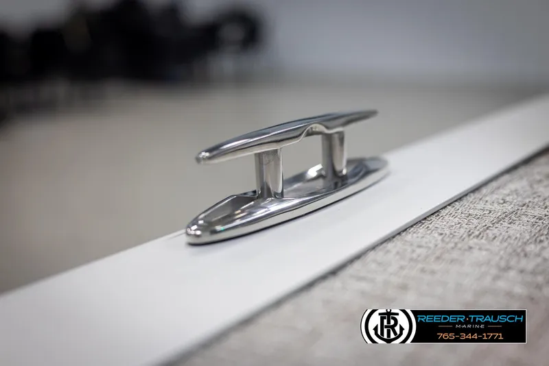 Slide: The Image of 2024 Avalon LSZ QL boat cleat, close-up view, Reeder-Trausch Marine logo. - 43