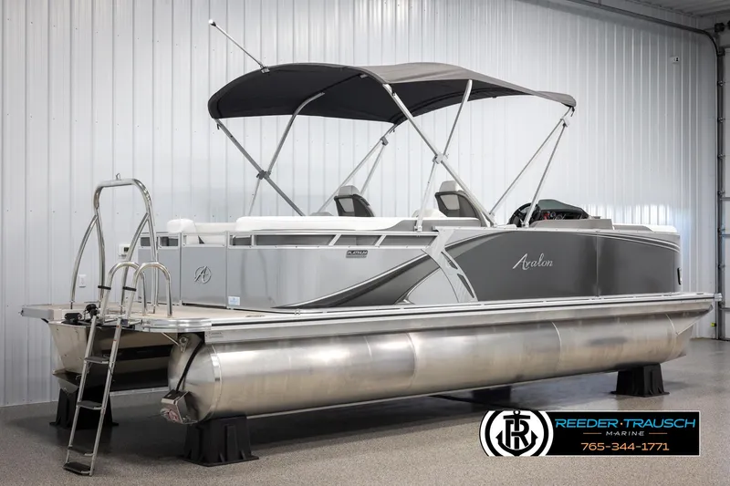 Slide: The Image of 2024 Avalon LSZ QL pontoon boat with canopy in showroom. - 6
