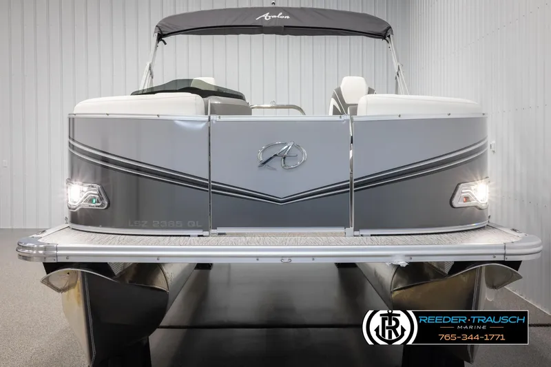 Slide: The Image of 2024 Avalon LSZ QL pontoon boat, front view, in showroom. - 8