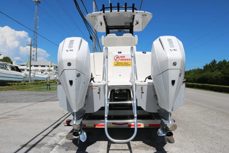 Slide: The Image of 2025 World Cat 280 CC-X boat with twin V6 engines, rear view. - 11