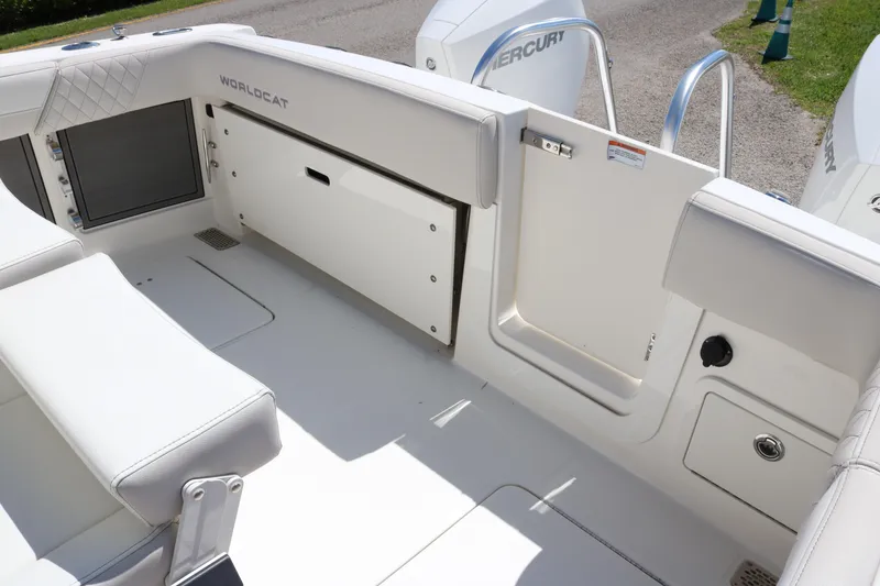 Slide: The Image of 2025 World Cat 280 CC-X boat interior with white seating and storage compartments. - 20