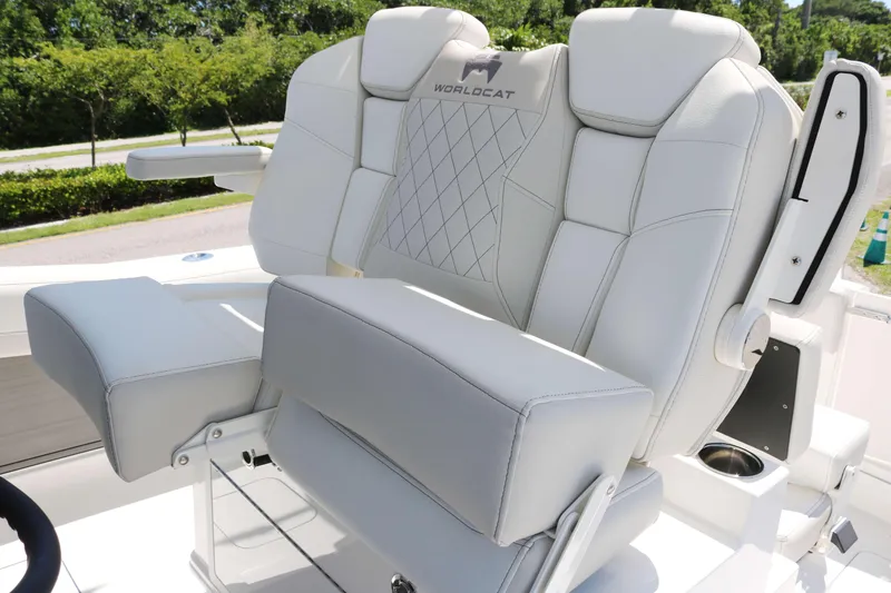 Slide: The Image of Luxury seating on 2025 World Cat 280 CC-X boat, featuring plush white upholstery. - 14