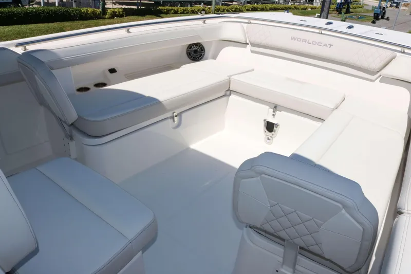 Slide: The Image of 2025 World Cat 280 CC-X boat interior with white seating and modern design. - 15