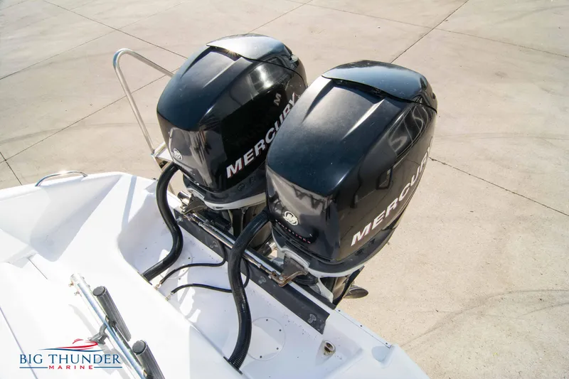 Slide: The Image of Twin Mercury outboard engines on a 2005 Donzi 32 ZF boat. - 10