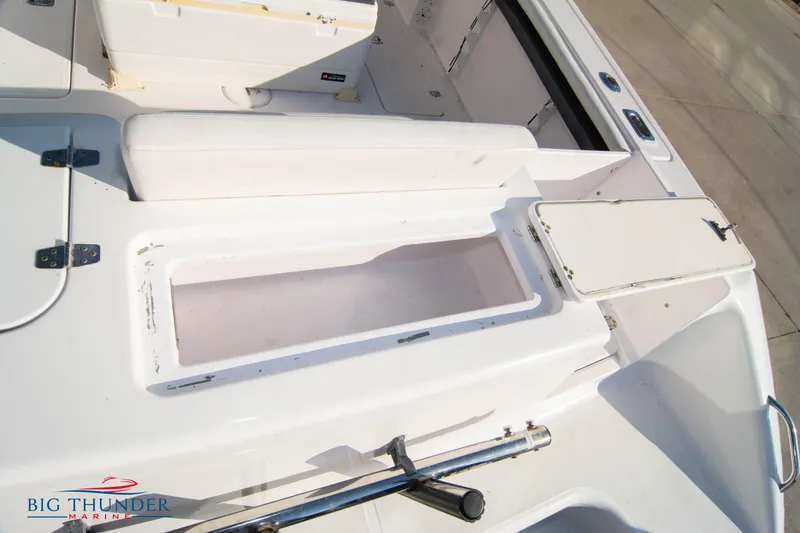 Slide: The Image of 2005 Donzi 32 ZF boat interior with storage compartments and seating. - 11