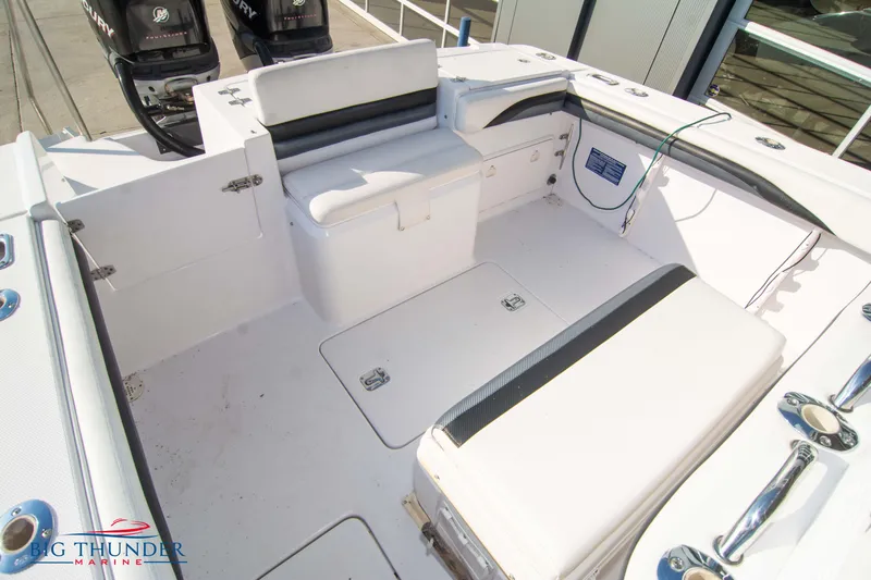 Slide: The Image of 2005 Donzi 32 ZF boat interior with seating and storage compartments. - 14