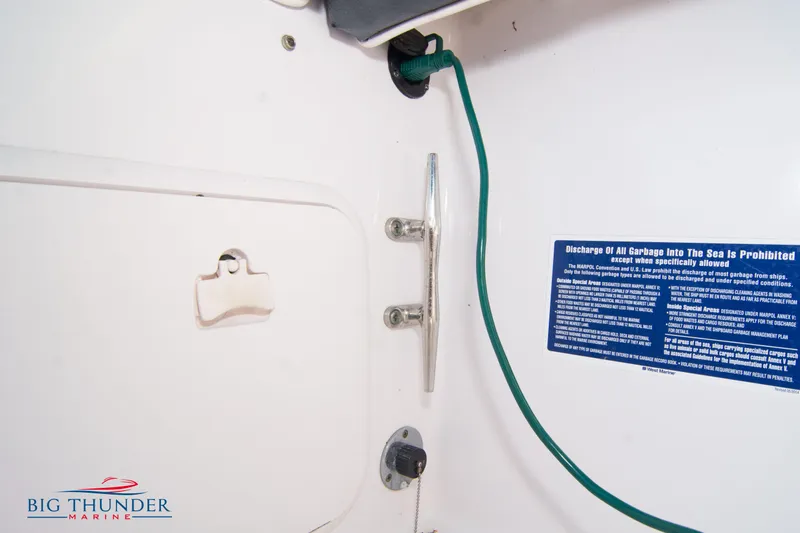 Slide: The Image of 2005 Donzi 32 ZF boat interior with Big Thunder Marine logo and safety notice. - 18