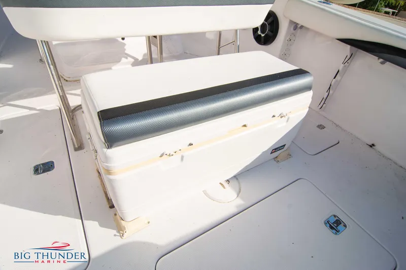 Slide: The Image of 2005 Donzi 32 ZF boat interior with seating and storage compartment. - 21