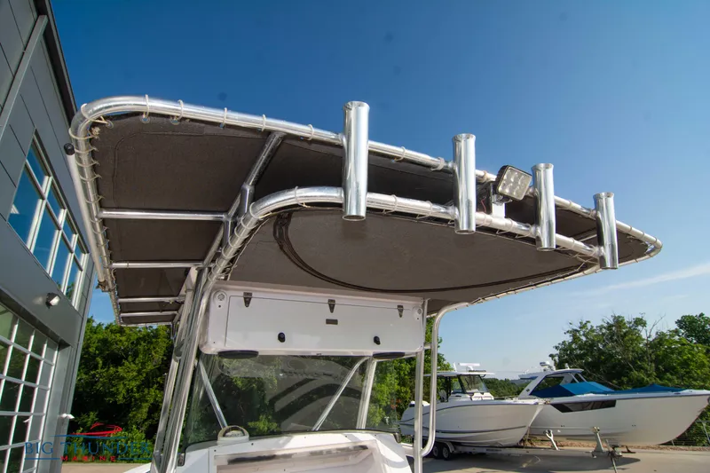 Slide: The Image of 2005 Donzi 32 ZF boat with T-top and rod holders. - 23