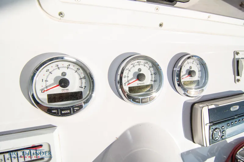Slide: The Image of Close-up of 2005 Donzi 32 ZF boat dashboard gauges and controls. - 30