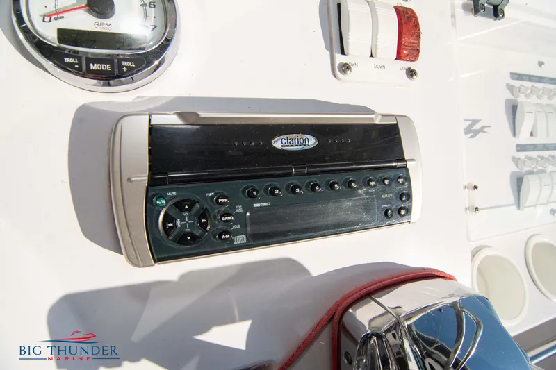 Slide: The Image of Close-up of the dashboard controls on a 2005 Donzi 32 ZF boat. - 34
