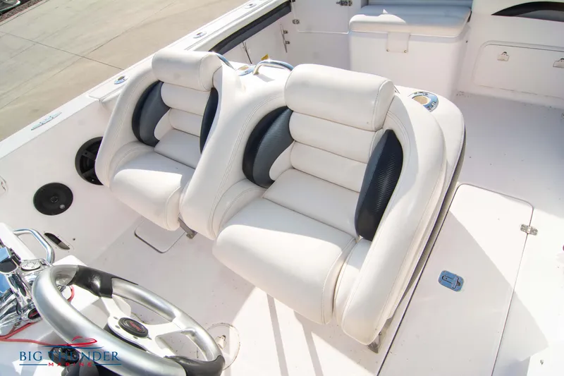 Slide: The Image of 2005 Donzi 32 ZF boat interior with dual white and black cushioned seats. - 41