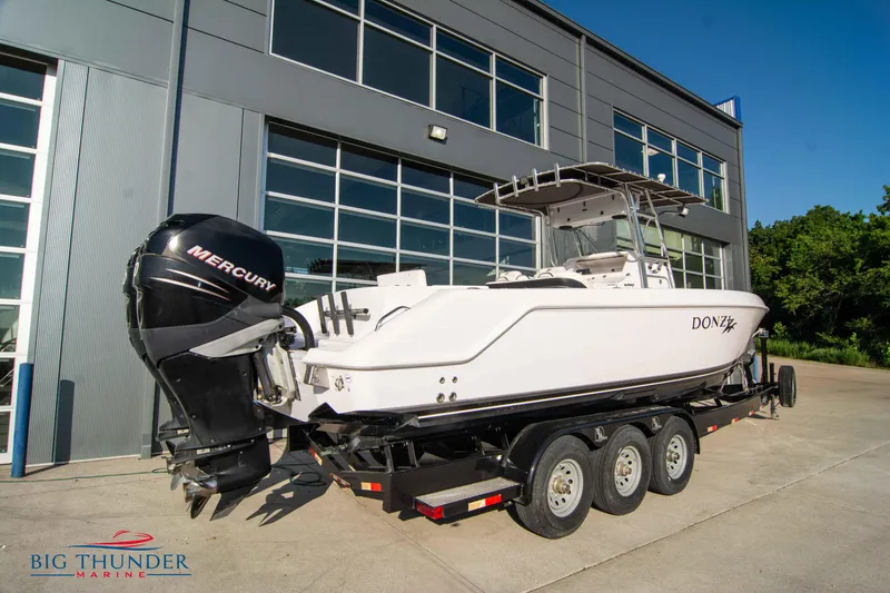 Slide: The Image of 2005 Donzi 32 ZF boat on a trailer outside Big Thunder Marine. - 5