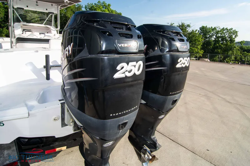 Slide: The Image of Twin Mercury 250 outboard engines on a 2005 Donzi 32 ZF boat. - 7