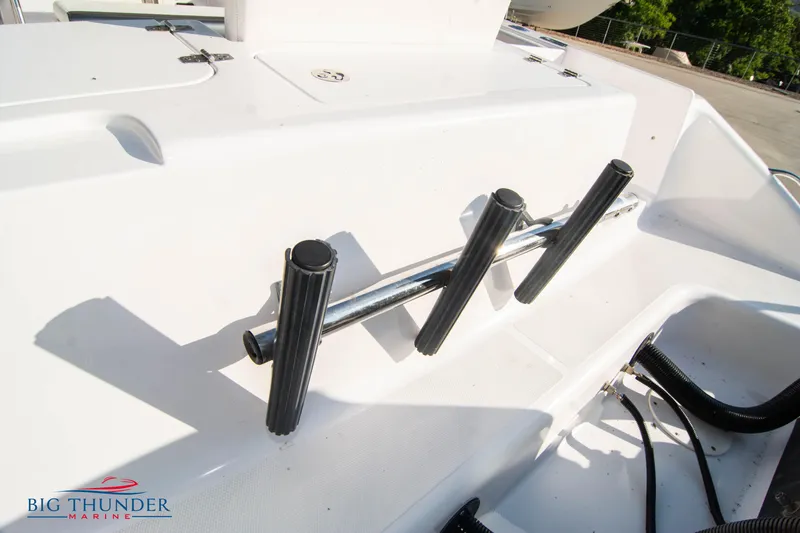 Slide: The Image of Rod holders on a 2005 Donzi 32 ZF boat deck at Big Thunder Marine. - 9