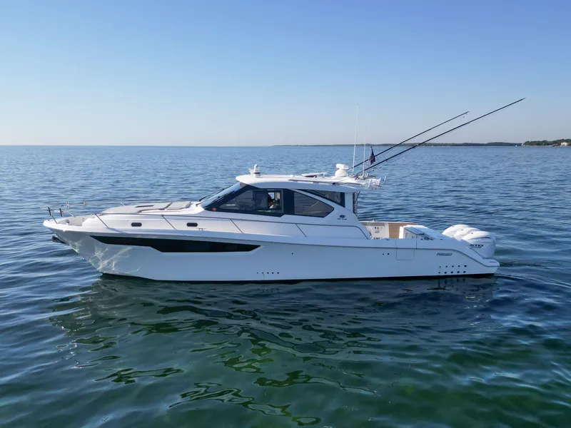 Slide: The Image of 2024 Pursuit OS 445 Offshore boat on calm ocean waters. - 12